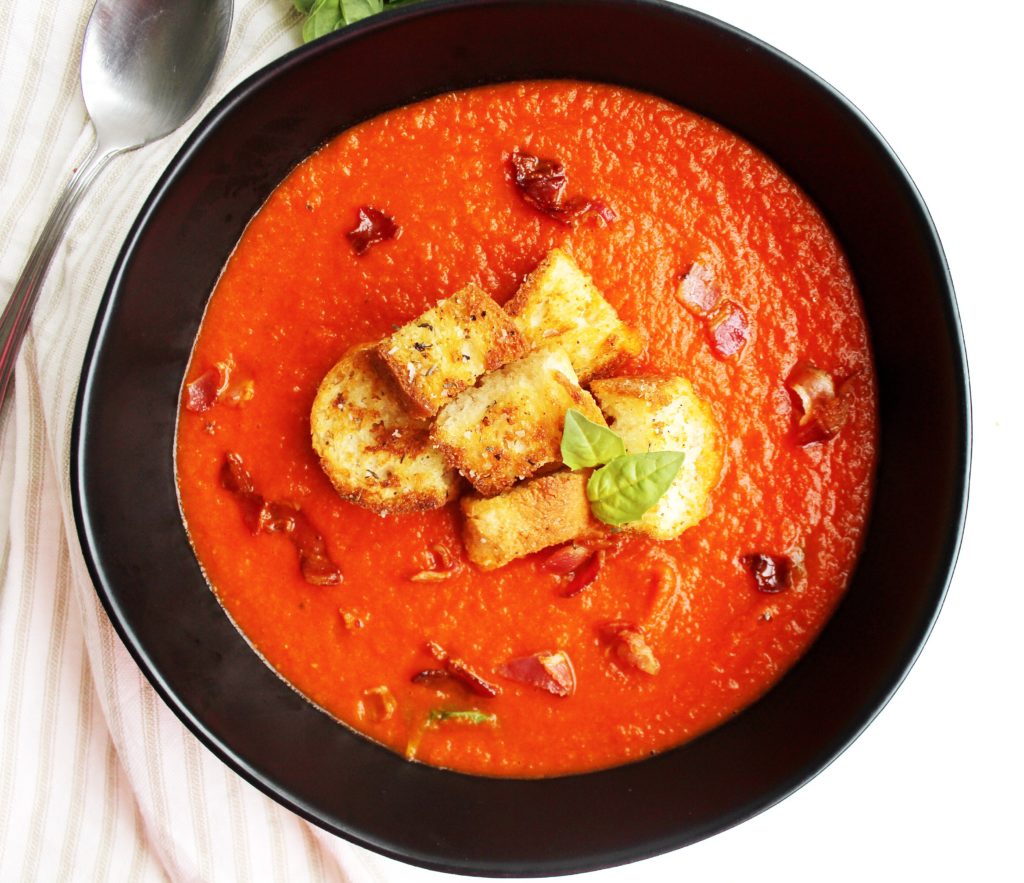 Tomato Basil Soup topped with Croutons, Crispy Pancetta and Basil