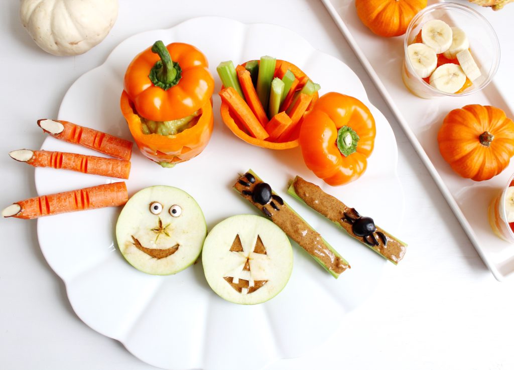 Platter of Whole 30 Halloween treats and pumpkins 
