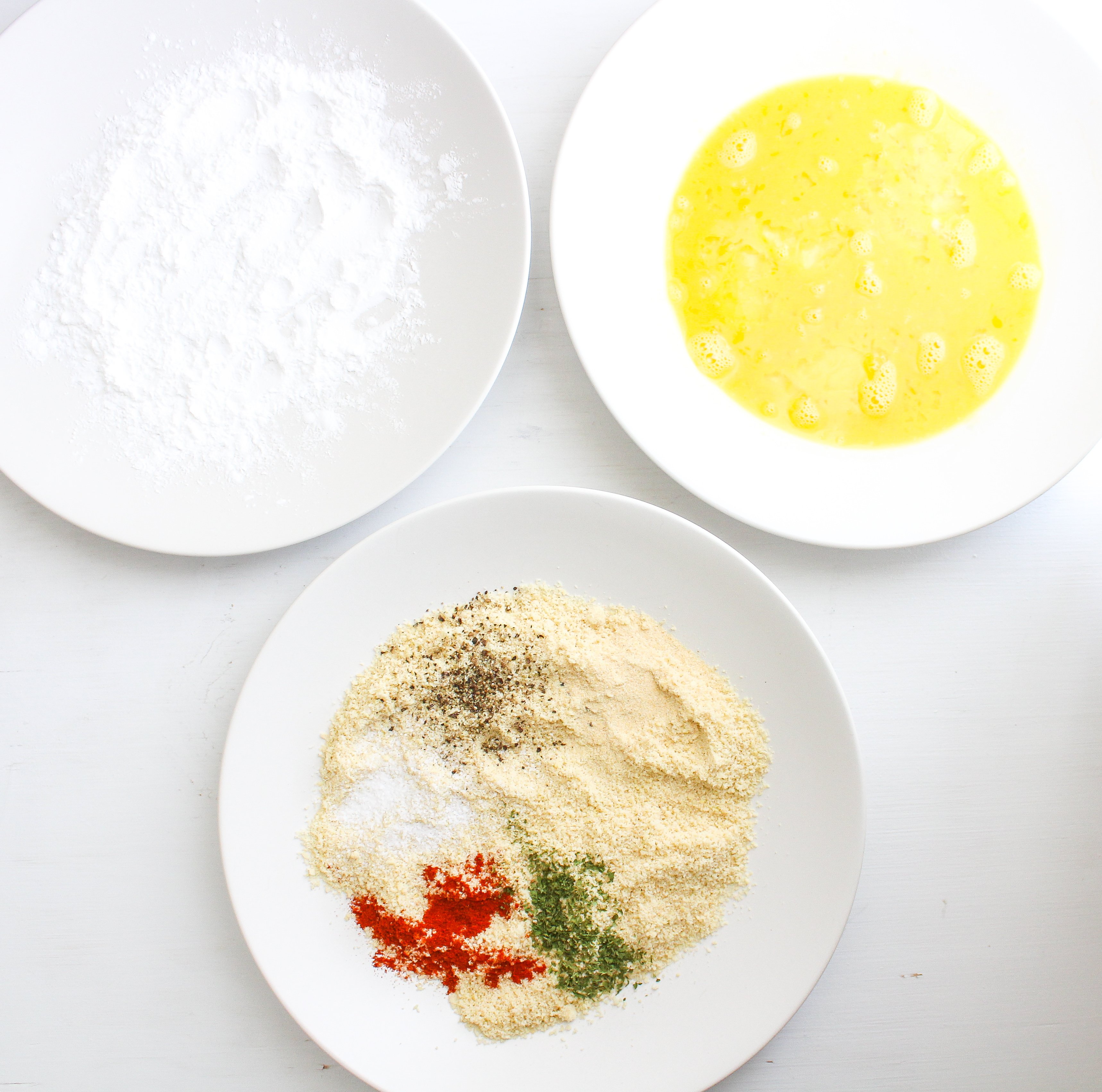 Polish Pork Cutlets 3 shallow plates, one has starch, one has beaten eggs and one has seasoned flour