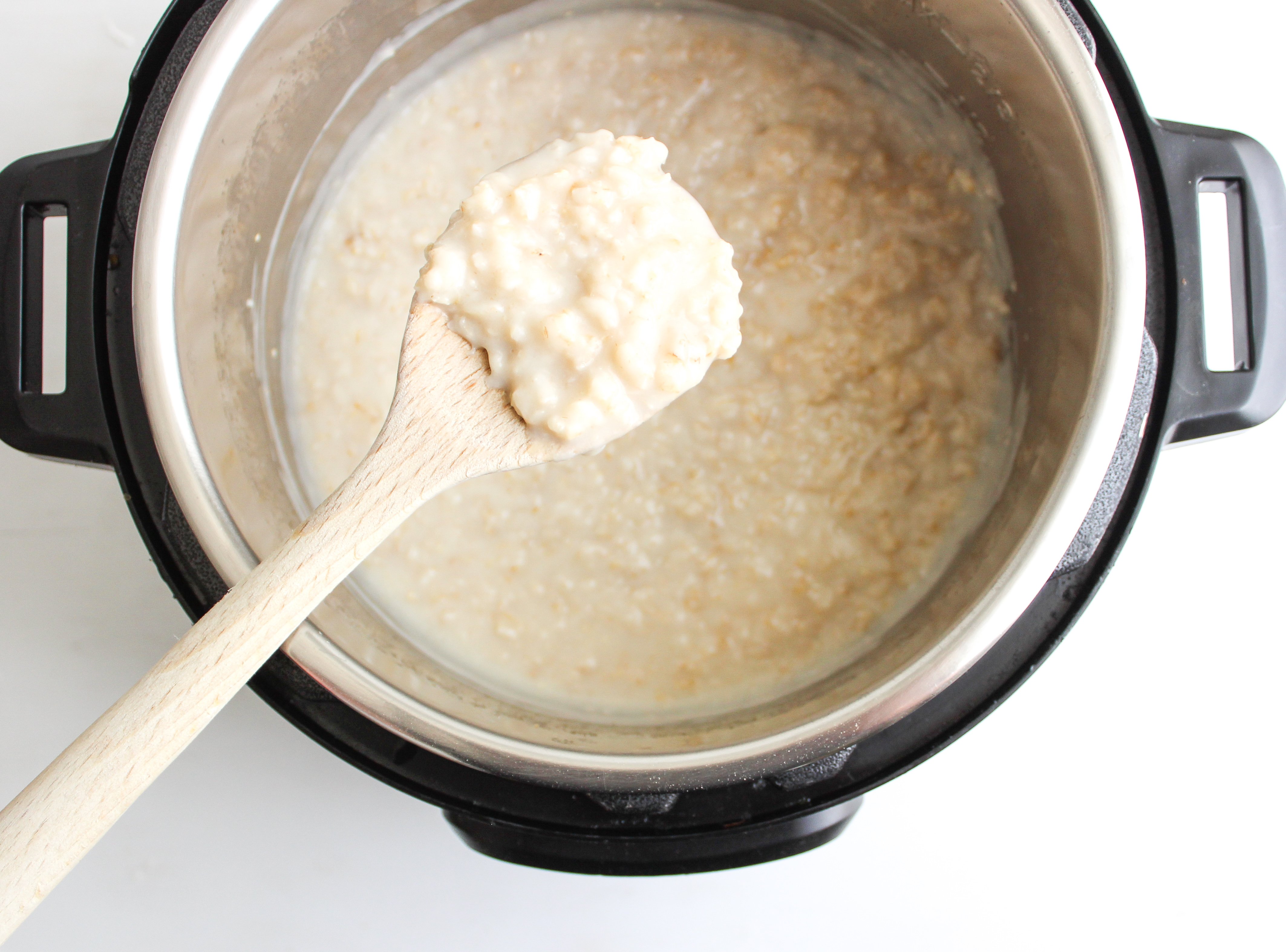 Spoon scooping Creamy Instant Pot Oatmeal