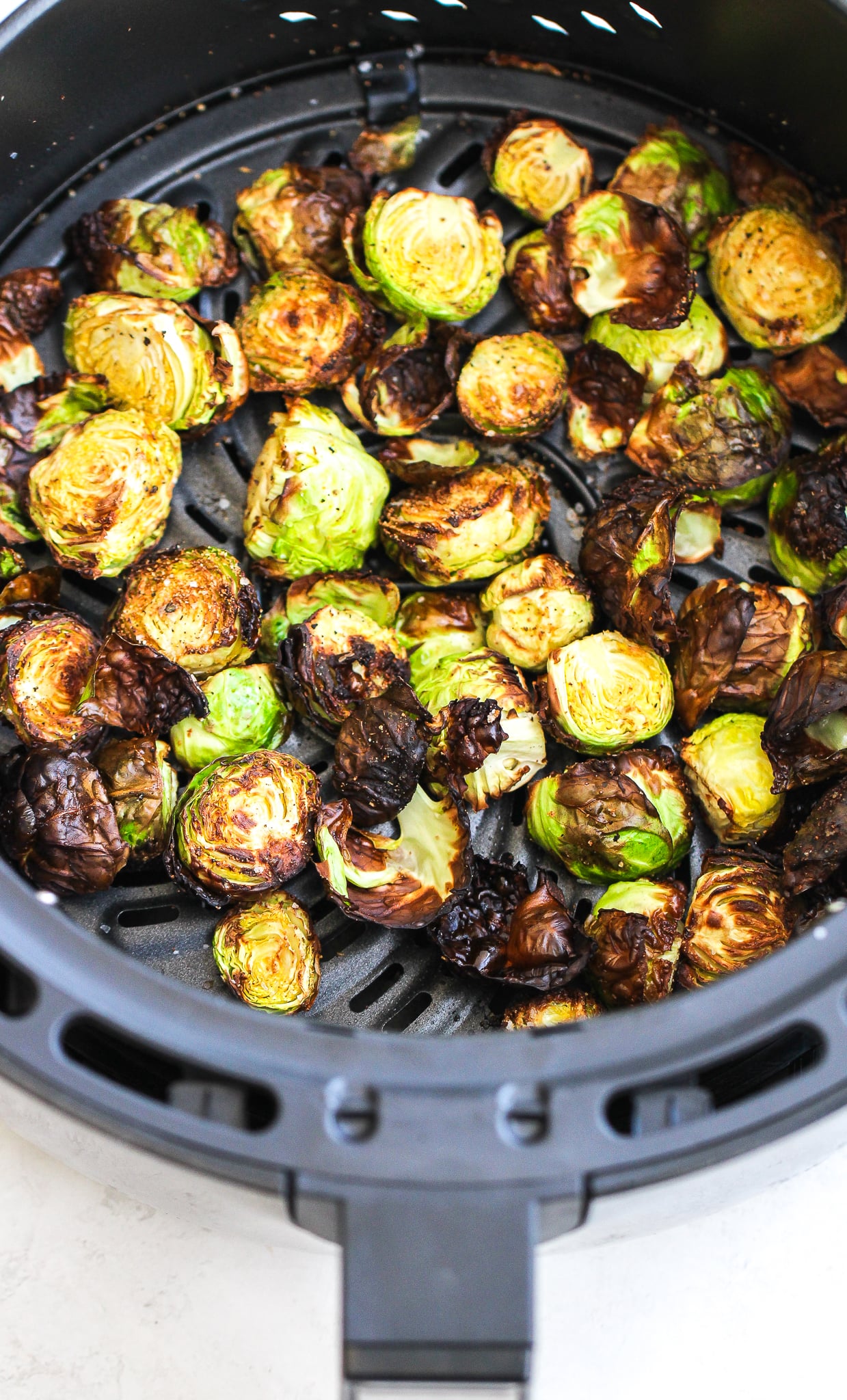 crispy brussels sprouts in the air fryer container 