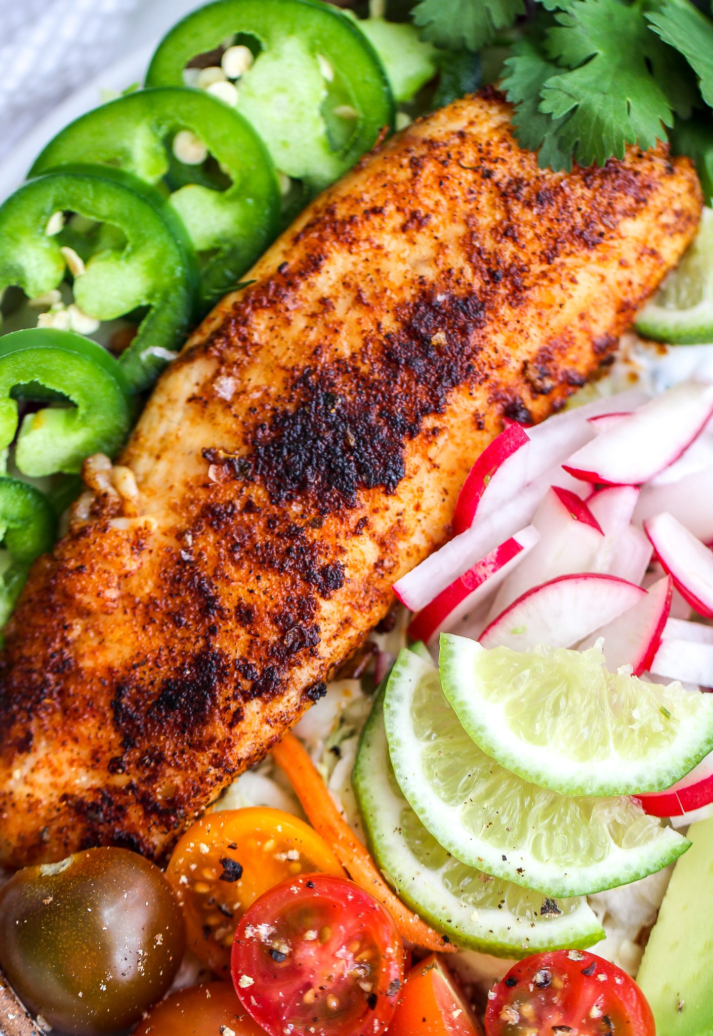 close up shot of blackened fish in the fish taco bowl 