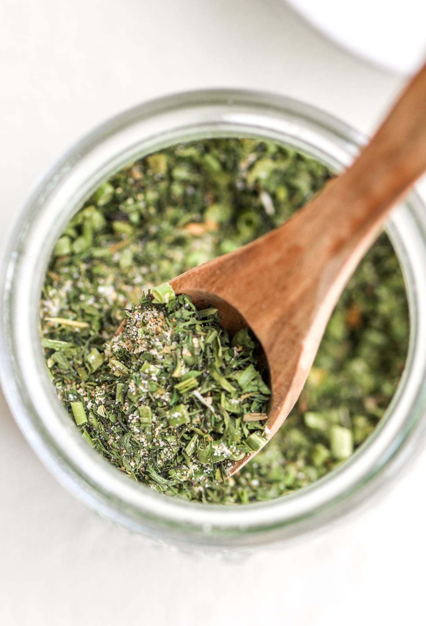 close up of wooden spoon in healthy homemade ranch seasoning