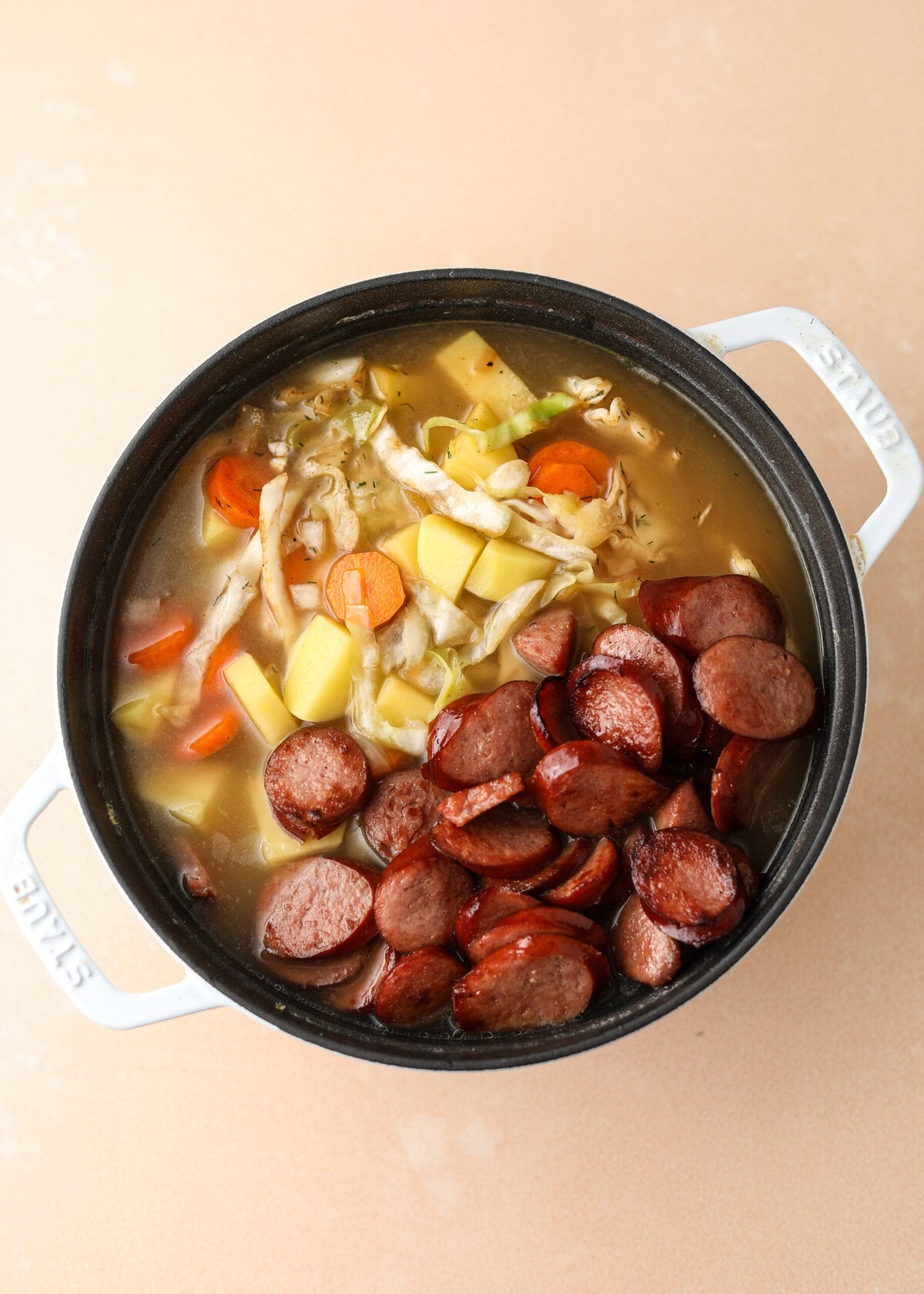 overhead shot of the final step in making kielbasa and cabbage soup