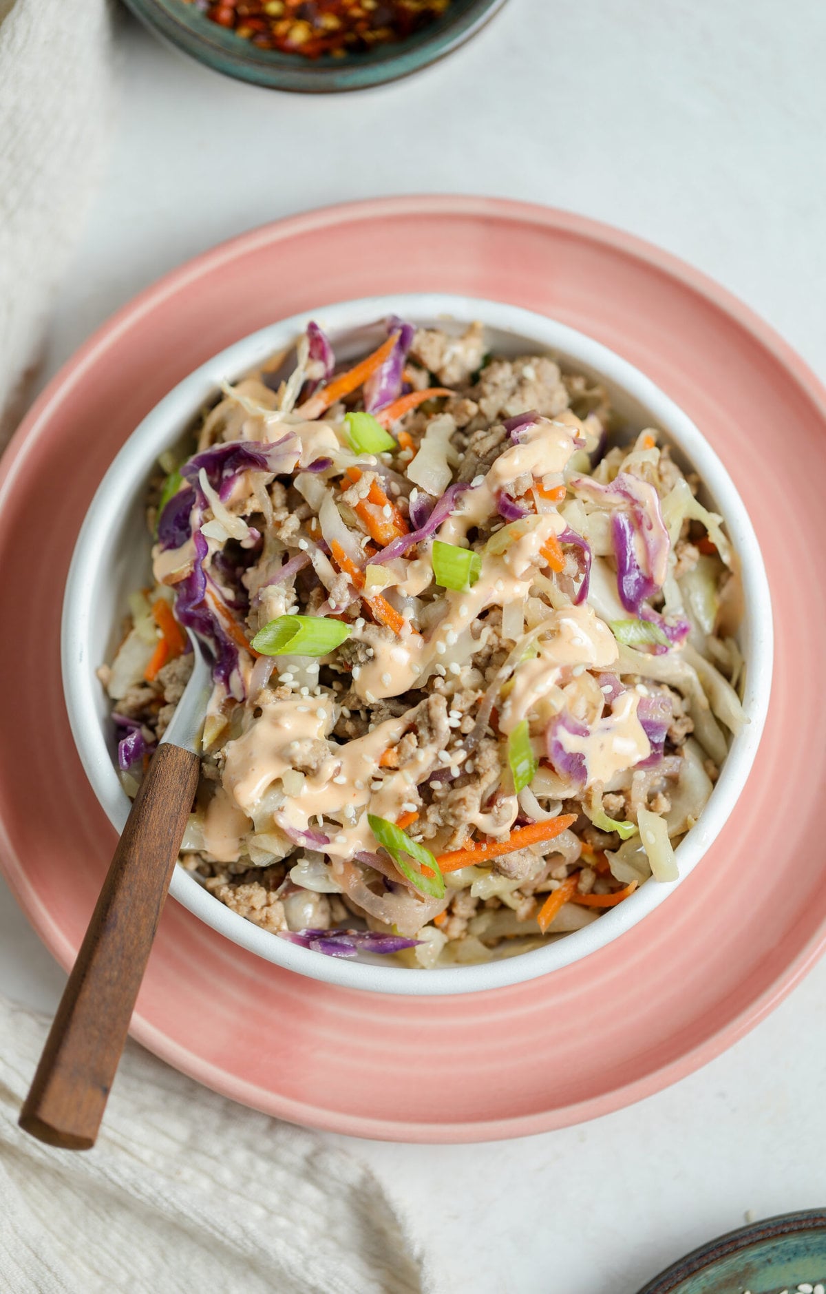 Egg roll in a bowl recipe served in a bowl with a fork next to it.